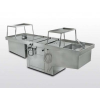 Adjustable and aspirated autopsy table in steel