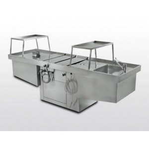 Adjustable and aspirated autopsy table in steel